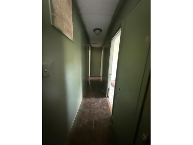 This 3-bedroom, 2-bath home sits on a large corner lot and on Cherokee Village North Course in Arkansas - for sale on GolfHomes.com, golf home, golf lot