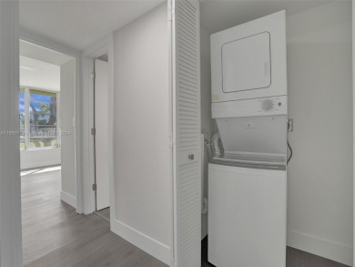 Discover luxurious living in this fully renovated 3-bedroom on Palm-Aire Country Club and Resort - The Oaks in Florida - for sale on GolfHomes.com, golf home, golf lot