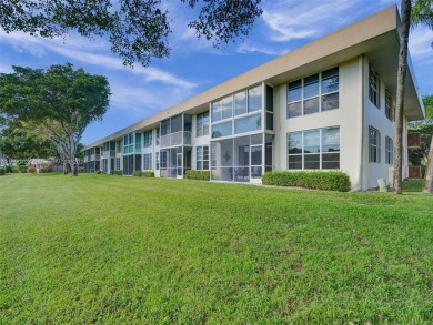 Discover luxurious living in this fully renovated 3-bedroom on Palm-Aire Country Club and Resort - The Oaks in Florida - for sale on GolfHomes.com, golf home, golf lot
