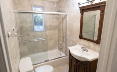 Step into timeless elegance in this classic Miami Beach home on Miami Beach Golf Club in Florida - for sale on GolfHomes.com, golf home, golf lot