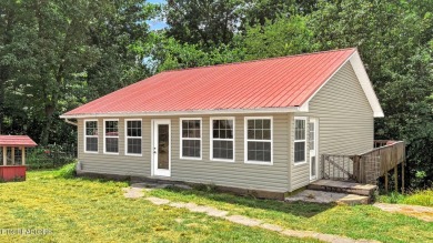 Nestled on 5 peaceful, wooded acres, this charming 2-bedroom on Wind River Golf Course in Tennessee - for sale on GolfHomes.com, golf home, golf lot