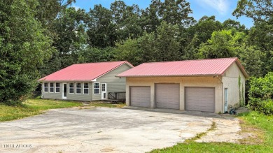 Nestled on 5 peaceful, wooded acres, this charming 2-bedroom on Wind River Golf Course in Tennessee - for sale on GolfHomes.com, golf home, golf lot