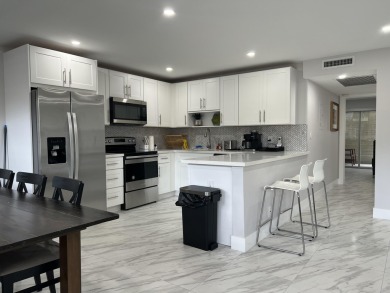 WELCOME HOME TO YOUR 2/2 TURNKEY, COMPLETELY RENOVATED on Wynmoor Golf Course in Florida - for sale on GolfHomes.com, golf home, golf lot