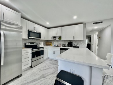 WELCOME HOME TO YOUR 2/2 TURNKEY, COMPLETELY RENOVATED on Wynmoor Golf Course in Florida - for sale on GolfHomes.com, golf home, golf lot