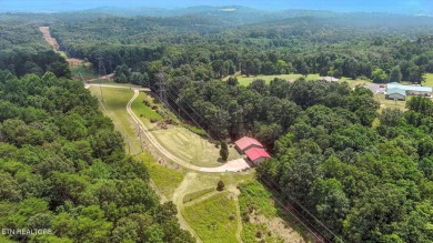 Nestled on 5 peaceful, wooded acres, this charming 2-bedroom on Wind River Golf Course in Tennessee - for sale on GolfHomes.com, golf home, golf lot