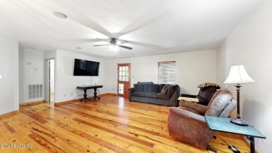 Nestled on 5 peaceful, wooded acres, this charming 2-bedroom on Wind River Golf Course in Tennessee - for sale on GolfHomes.com, golf home, golf lot