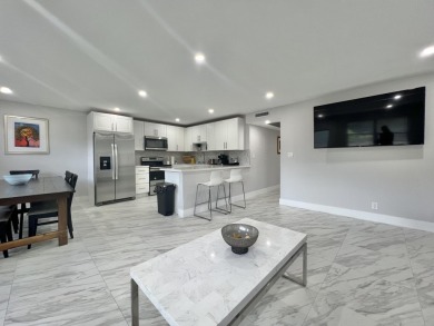 WELCOME HOME TO YOUR 2/2 TURNKEY, COMPLETELY RENOVATED on Wynmoor Golf Course in Florida - for sale on GolfHomes.com, golf home, golf lot