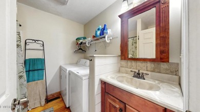 Nestled on 5 peaceful, wooded acres, this charming 2-bedroom on Wind River Golf Course in Tennessee - for sale on GolfHomes.com, golf home, golf lot