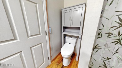 Nestled on 5 peaceful, wooded acres, this charming 2-bedroom on Wind River Golf Course in Tennessee - for sale on GolfHomes.com, golf home, golf lot