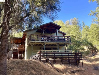 This cabin in the pines called 'Lil Oak Hill' is beautifully on Pine Mountain Lake Country Club in California - for sale on GolfHomes.com, golf home, golf lot