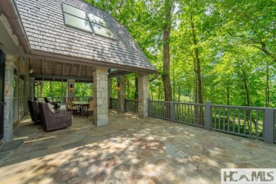 Situated on a large lot, prominently overlooking the 10th golf on Wade Hampton Golf Club in North Carolina - for sale on GolfHomes.com, golf home, golf lot