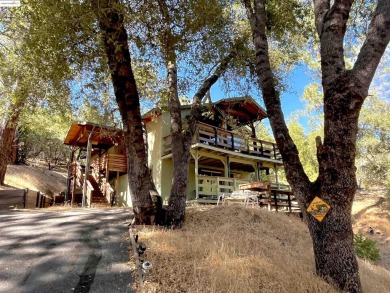 This cabin in the pines called 'Lil Oak Hill' is beautifully on Pine Mountain Lake Country Club in California - for sale on GolfHomes.com, golf home, golf lot