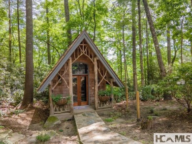 Situated on a large lot, prominently overlooking the 10th golf on Wade Hampton Golf Club in North Carolina - for sale on GolfHomes.com, golf home, golf lot