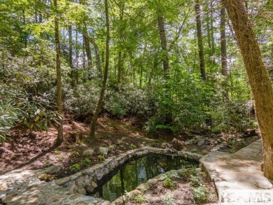 Situated on a large lot, prominently overlooking the 10th golf on Wade Hampton Golf Club in North Carolina - for sale on GolfHomes.com, golf home, golf lot