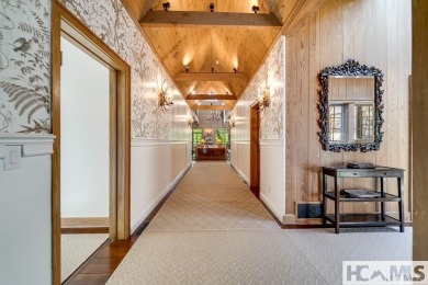 Situated on a large lot, prominently overlooking the 10th golf on Wade Hampton Golf Club in North Carolina - for sale on GolfHomes.com, golf home, golf lot