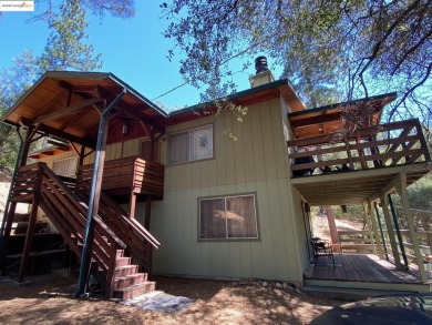 This cabin in the pines called 'Lil Oak Hill' is beautifully on Pine Mountain Lake Country Club in California - for sale on GolfHomes.com, golf home, golf lot