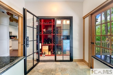 Situated on a large lot, prominently overlooking the 10th golf on Wade Hampton Golf Club in North Carolina - for sale on GolfHomes.com, golf home, golf lot
