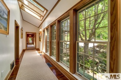 Situated on a large lot, prominently overlooking the 10th golf on Wade Hampton Golf Club in North Carolina - for sale on GolfHomes.com, golf home, golf lot