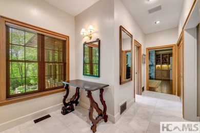 Situated on a large lot, prominently overlooking the 10th golf on Wade Hampton Golf Club in North Carolina - for sale on GolfHomes.com, golf home, golf lot