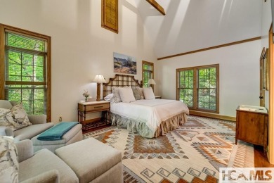 Situated on a large lot, prominently overlooking the 10th golf on Wade Hampton Golf Club in North Carolina - for sale on GolfHomes.com, golf home, golf lot