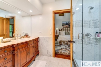 Situated on a large lot, prominently overlooking the 10th golf on Wade Hampton Golf Club in North Carolina - for sale on GolfHomes.com, golf home, golf lot