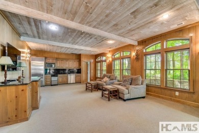 Situated on a large lot, prominently overlooking the 10th golf on Wade Hampton Golf Club in North Carolina - for sale on GolfHomes.com, golf home, golf lot