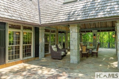 Situated on a large lot, prominently overlooking the 10th golf on Wade Hampton Golf Club in North Carolina - for sale on GolfHomes.com, golf home, golf lot