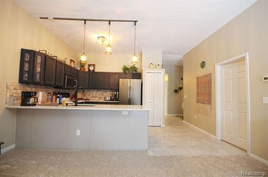 This lovely condo located directly across from White Lake Oaks on White Lake Oaks Golf Course in Michigan - for sale on GolfHomes.com, golf home, golf lot