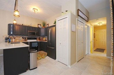 This lovely condo located directly across from White Lake Oaks on White Lake Oaks Golf Course in Michigan - for sale on GolfHomes.com, golf home, golf lot