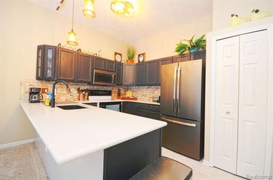 This lovely condo located directly across from White Lake Oaks on White Lake Oaks Golf Course in Michigan - for sale on GolfHomes.com, golf home, golf lot