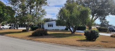 Welcome home to this charming 940 sq. ft., 2-bedroom, 1-bath on Orange Blossom Hills Golf and Country Club in Florida - for sale on GolfHomes.com, golf home, golf lot