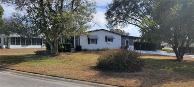 Welcome home to this charming 940 sq. ft., 2-bedroom, 1-bath on Orange Blossom Hills Golf and Country Club in Florida - for sale on GolfHomes.com, golf home, golf lot