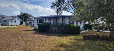 Welcome home to this charming 940 sq. ft., 2-bedroom, 1-bath on Orange Blossom Hills Golf and Country Club in Florida - for sale on GolfHomes.com, golf home, golf lot