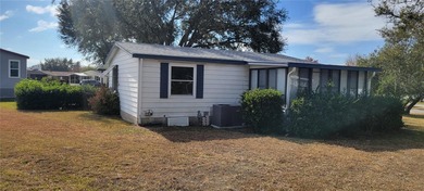 Welcome home to this charming 940 sq. ft., 2-bedroom, 1-bath on Orange Blossom Hills Golf and Country Club in Florida - for sale on GolfHomes.com, golf home, golf lot