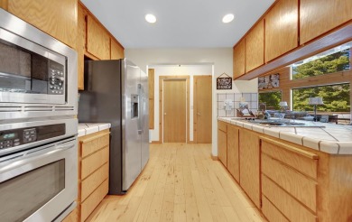 Experience the perfect mountain lifestyle in this wonderful Lake on Lake Almanor West Golf Course in California - for sale on GolfHomes.com, golf home, golf lot