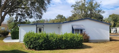 Welcome home to this charming 940 sq. ft., 2-bedroom, 1-bath on Orange Blossom Hills Golf and Country Club in Florida - for sale on GolfHomes.com, golf home, golf lot