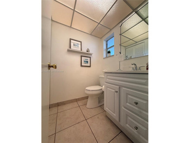 One bedroom one and a half bedroom condo in resort like + on Sunrise Lakes Phase III in Florida - for sale on GolfHomes.com, golf home, golf lot