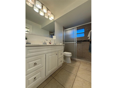 One bedroom one and a half bedroom condo in resort like + on Sunrise Lakes Phase III in Florida - for sale on GolfHomes.com, golf home, golf lot