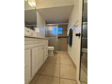 One bedroom one and a half bedroom condo in resort like + on Sunrise Lakes Phase III in Florida - for sale on GolfHomes.com, golf home, golf lot