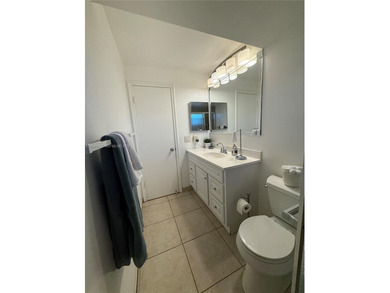 One bedroom one and a half bedroom condo in resort like + on Sunrise Lakes Phase III in Florida - for sale on GolfHomes.com, golf home, golf lot