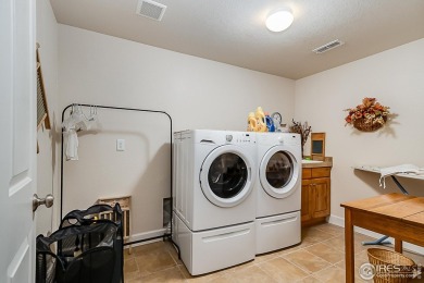 Welcome to this spacious ranch-style townhome near Buffalo Run! on Buffalo Run Golf Course in Colorado - for sale on GolfHomes.com, golf home, golf lot