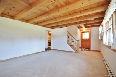 This unique Cape Cod is located in the Gottscheer Country Club on Osiris Country Club in New York - for sale on GolfHomes.com, golf home, golf lot