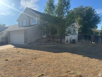 Fantastic value in Layton! This multi-level home offers 3 on Sun Hills Golf Course in Utah - for sale on GolfHomes.com, golf home, golf lot