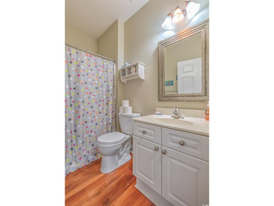 Tucked inside a private gated community in the heart of Murrells on Indigo Creek Golf Club in South Carolina - for sale on GolfHomes.com, golf home, golf lot