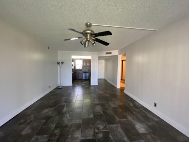 Step into this spacious condo, ideally situated on the 3rd floor on Boca Dunes Golf and Country Club in Florida - for sale on GolfHomes.com, golf home, golf lot