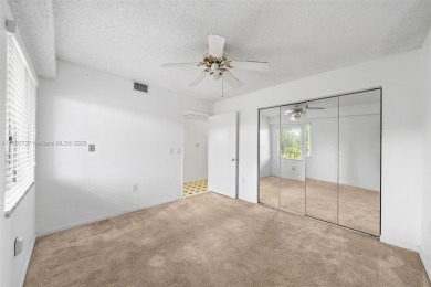 Resort-Style Living in Century Village! Enjoy stunning lake on Flamingo Lakes Country Club in Florida - for sale on GolfHomes.com, golf home, golf lot