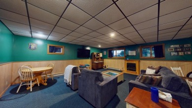 This ranch-style home offers an impressive array of features on The Pines Golf Course at Lake Isabella in Michigan - for sale on GolfHomes.com, golf home, golf lot