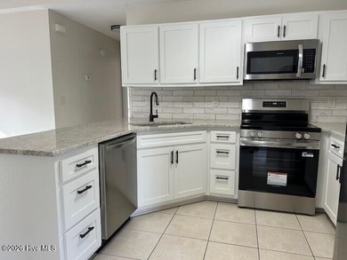 Charming cottage with 11 foot ceilings, bright and airy with a on Pearl Golf Links in North Carolina - for sale on GolfHomes.com, golf home, golf lot