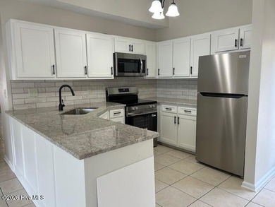 Charming cottage with 11 foot ceilings, bright and airy with a on Pearl Golf Links in North Carolina - for sale on GolfHomes.com, golf home, golf lot