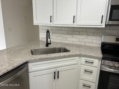 Charming cottage with 11 foot ceilings, bright and airy with a on Pearl Golf Links in North Carolina - for sale on GolfHomes.com, golf home, golf lot